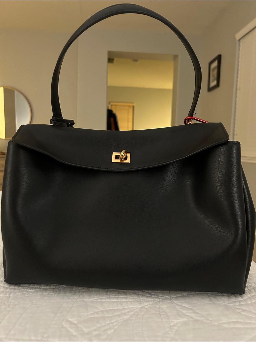 Black Leather Top-Handle Bag with Gold Hardware, keychain and lucky charm